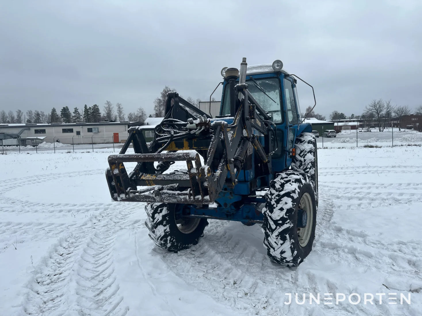 Ford 7700 med trima lastare