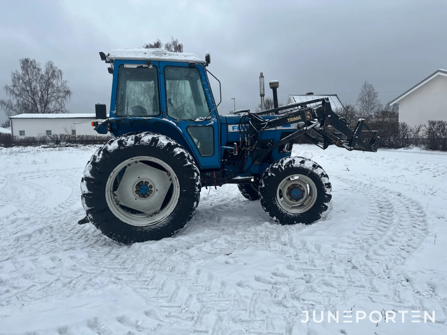 Ford 7700 med trima lastare