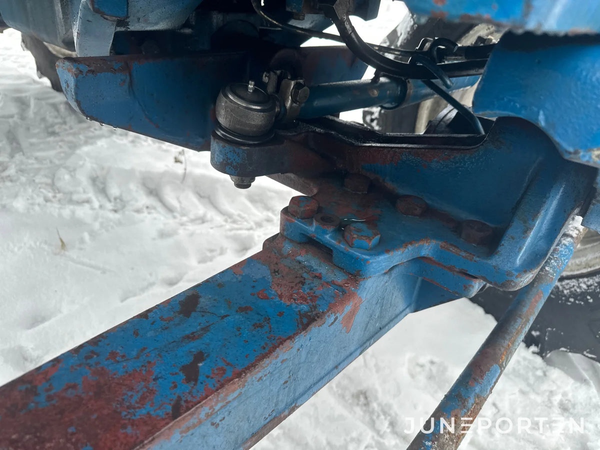 Ford 7700 med trima lastare