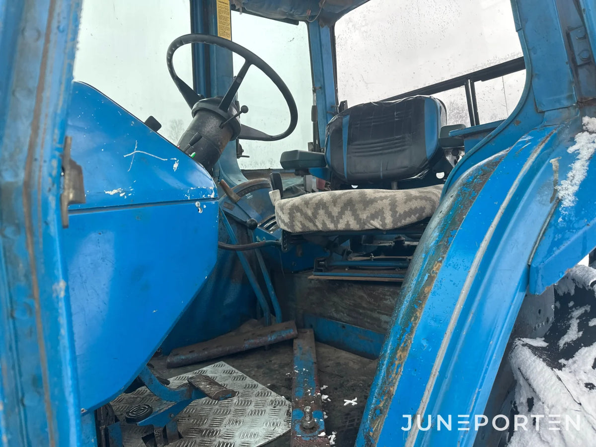 Ford 7700 med trima lastare