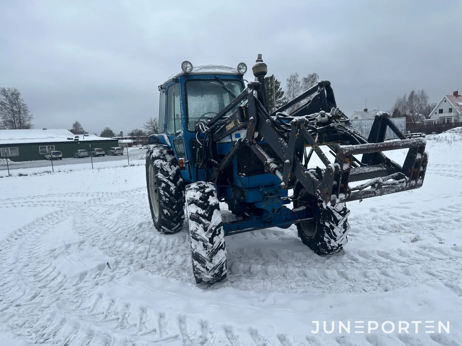 Ford 7700 med trima lastare