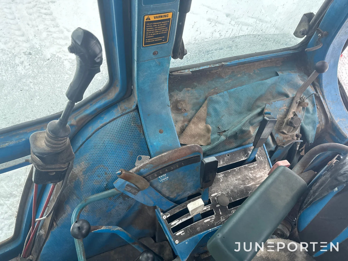 Ford 7700 med trima lastare