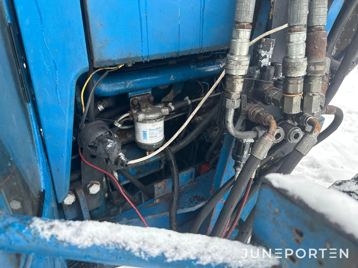 Ford 7700 med trima lastare
