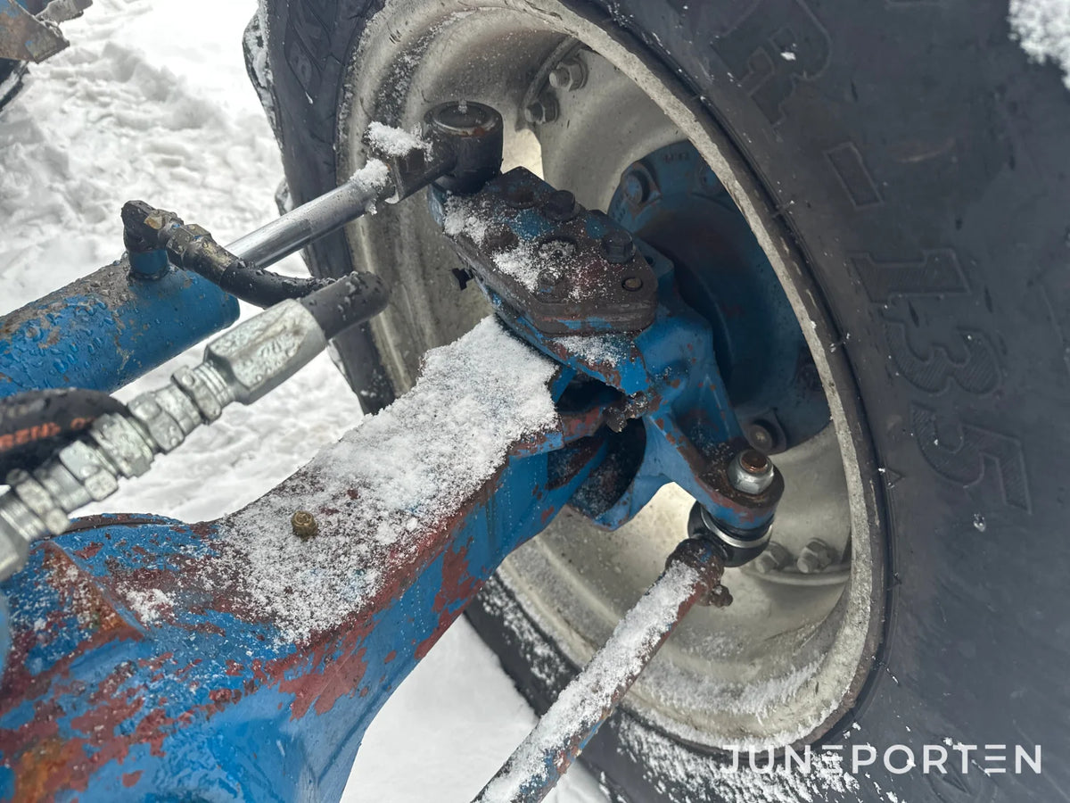 Ford 7700 med trima lastare