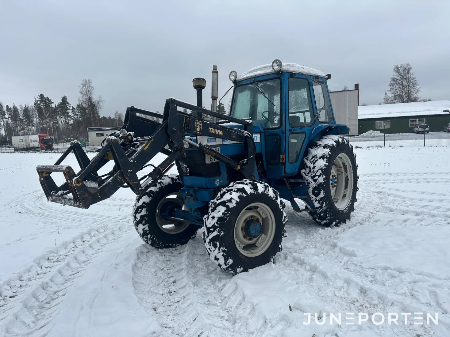 Ford 7700 med trima lastare