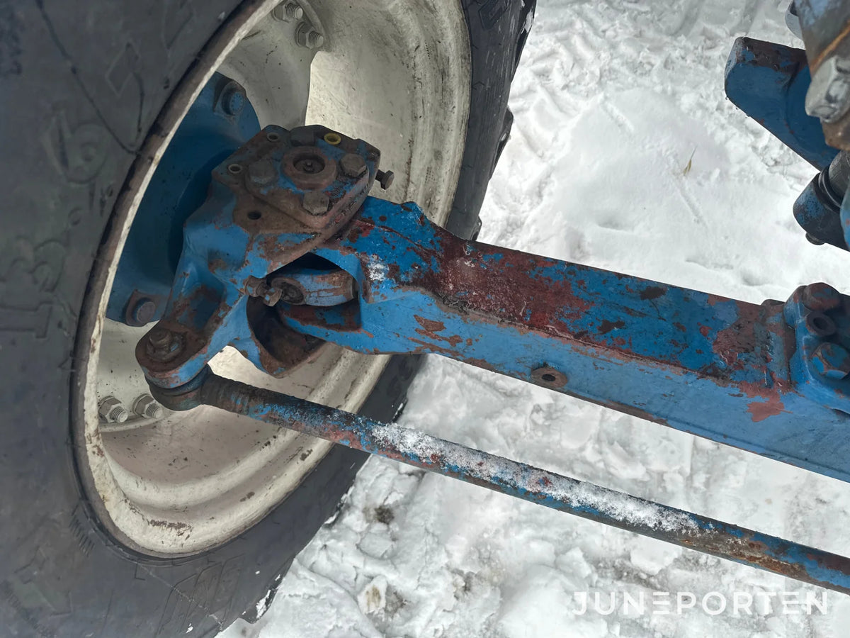 Ford 7700 med trima lastare