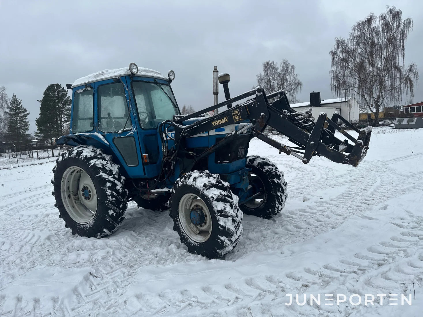 Ford 7700 med trima lastare
