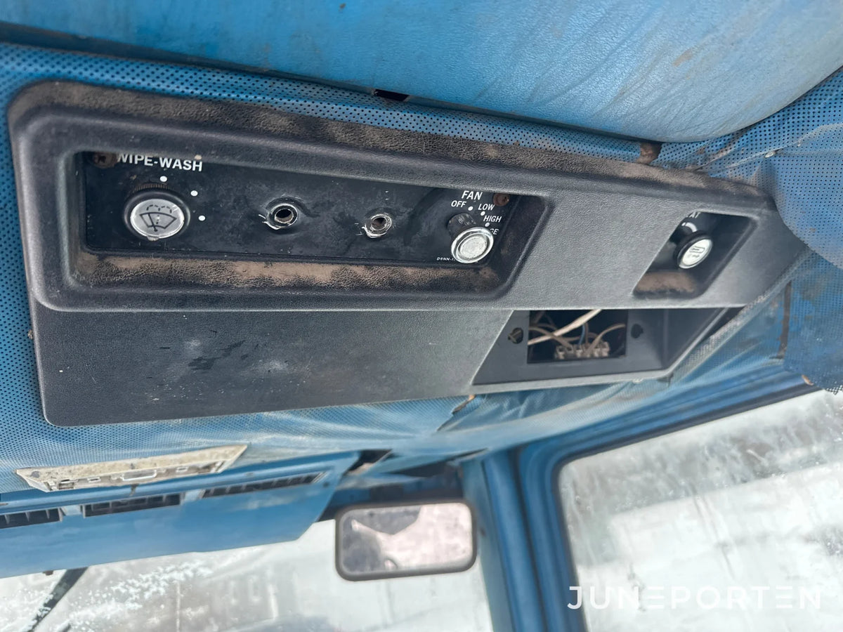 Ford 7700 med trima lastare