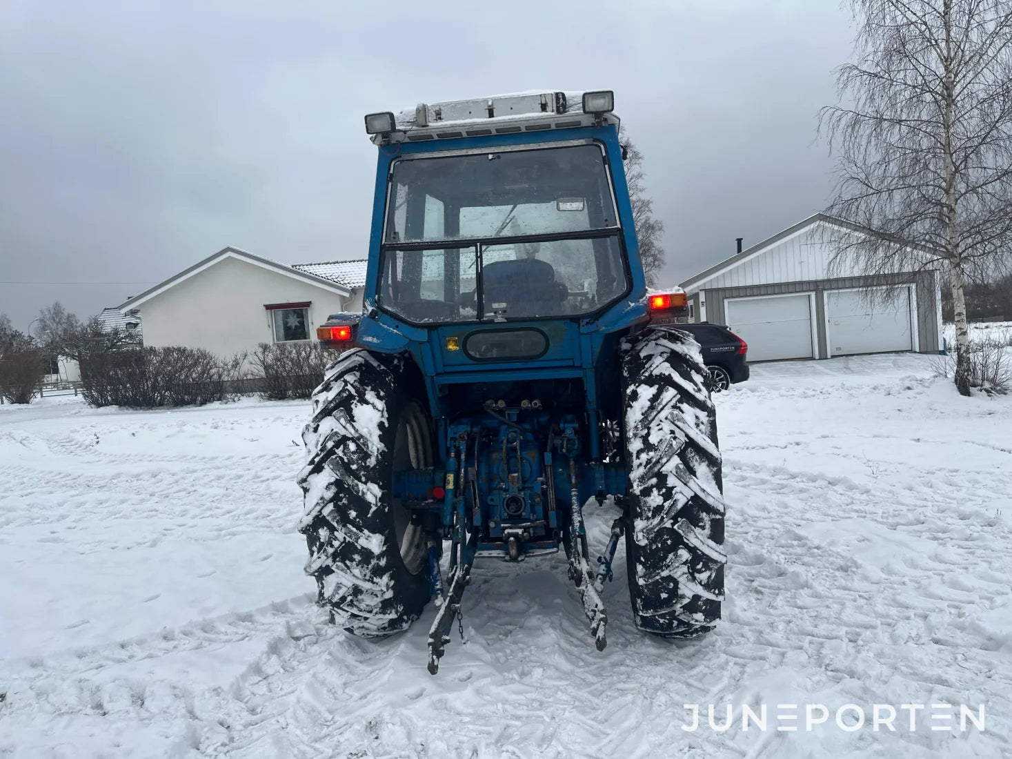 Ford 7700 med trima lastare