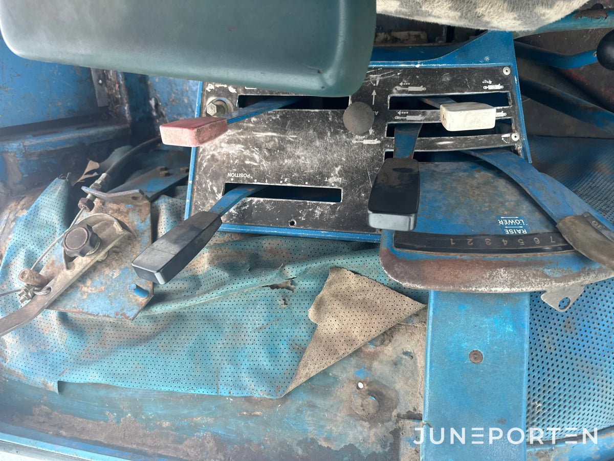 Ford 7700 med trima lastare