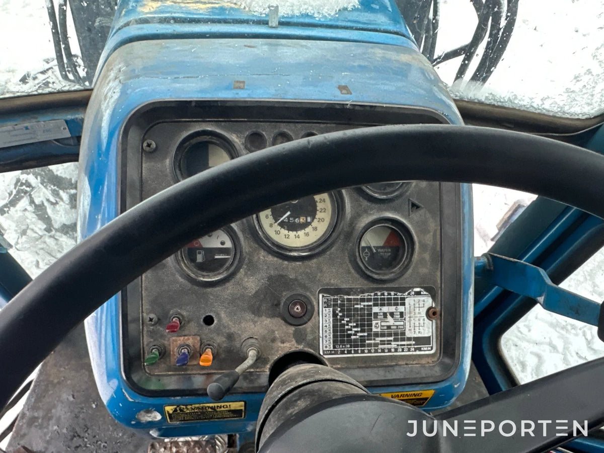 Ford 7700 med trima lastare