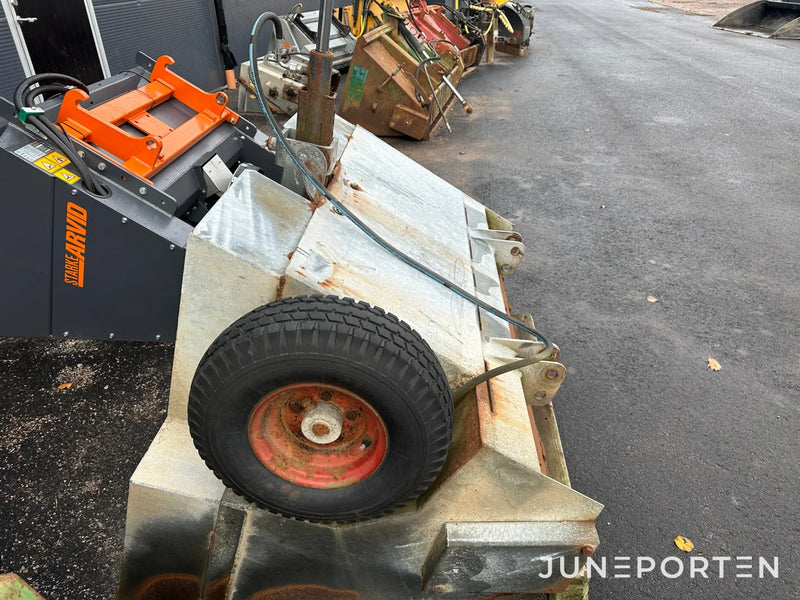 Sandspridare självlastande